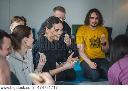 Vilnius, Lithuania - March 26 2023: Group Of Young Beautiful People Enjoying Time Together And Eatin