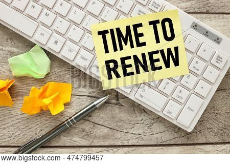 Time To Renew Yellow Sticker On A White Keyboard. Near Colorful Stickers