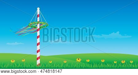 Maypole With Colorful Ribbons On Green Meadow
