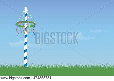 Maypole With Colorful Ribbons On Green Meadow