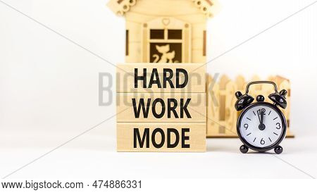 Hard Work Mode Symbol. Concept Words Hard Work Mode On Wooden Block On A Beautiful White Table White