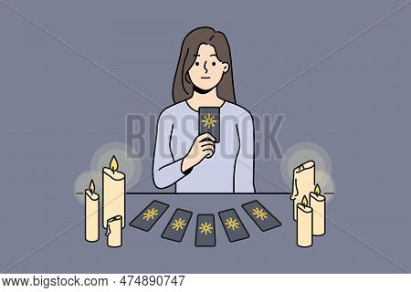Female Soothsayer Sit At Table With Cards Predict Future. Witch Or Magician Tell Fortune With Tarot 