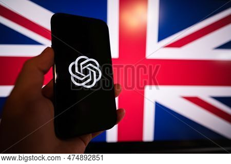 Kyiv, Ukraine - April, 2023: Hold Smartphone With Openai Chat Gpt Against United Kingdom Flag On Scr