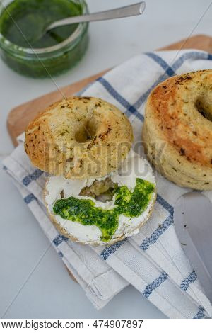 Home Made Whole Grain Bagels With Wild Garic On A Table
