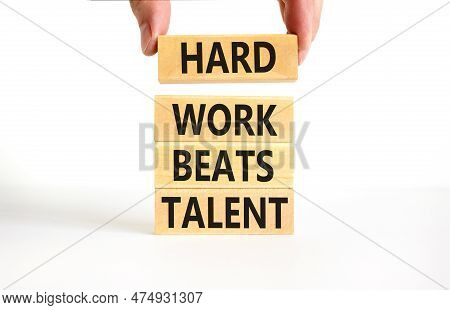 Hard Work Beats Talent Symbol. Concept Words Hard Work Beats Talent On Woodenblock. Beautiful White 