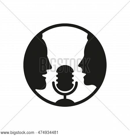 A Man And A Woman Speak Into A Microphone.