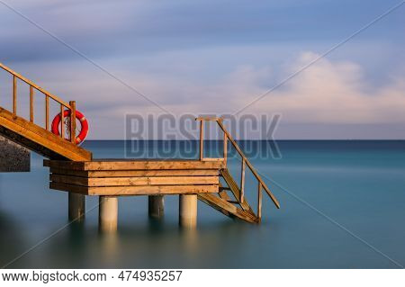 Stairway Goes Down To The Ocean From Overwater Villa. Long Exposure Picture Taken At Crossroads Mald