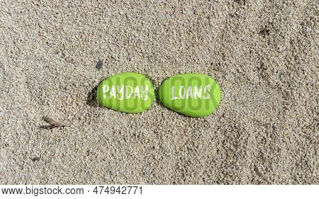 Payday Loans Symbol. Concept Words Payday Loans On Beautiful Green Stone. Beautiful Sand Sea Beach B