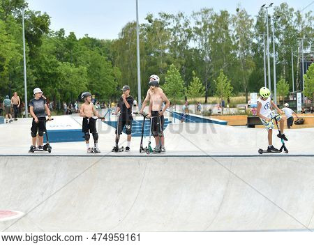 06.03.2022. Ukraine, Kyiv, Vdng Park. Children And Teenagers Ride Skateboards