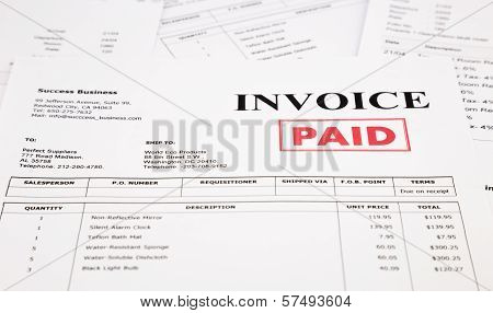 Invoice And Bills With Paid Stamp