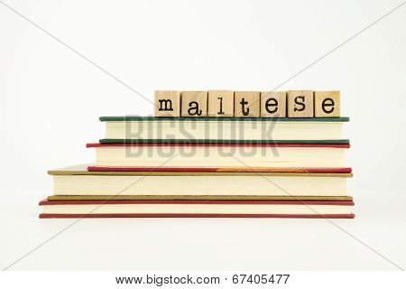 Maltese Language Word On Wood Stamps And Books