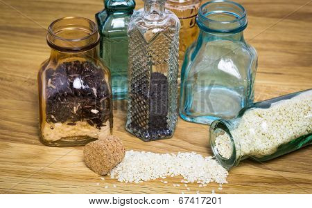 Sesami Seed And Rice In Bottles