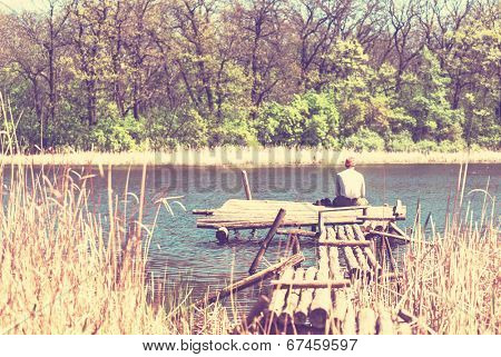 Man on summer lake