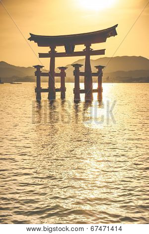 Miyajima, Famous Big Shinto Torii Standing In The Ocean In Hiroshima, Japan