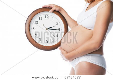 beauty pregnant woman with clock wait childbirth over white background