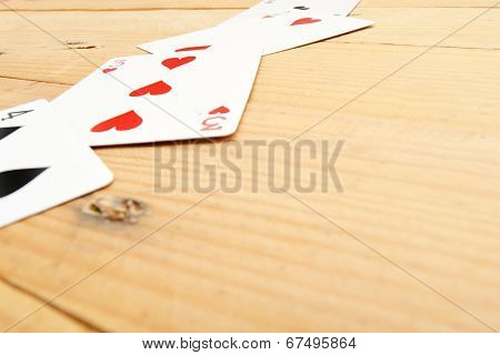 Many poker cards on a wood table