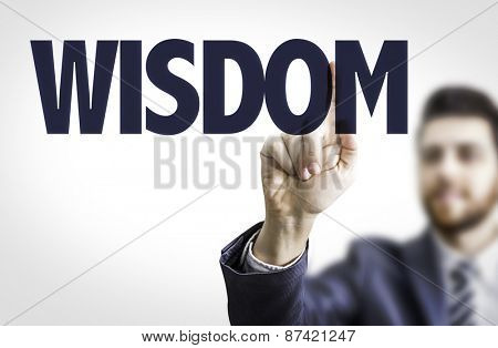 Business man pointing the text: Wisdom