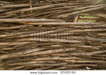 Fragment Of A Fence From Branches Woven Together.