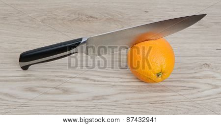 Orange With Knife