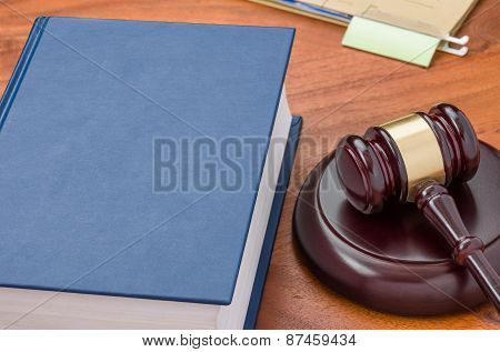 A Law Book With A Gavel