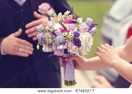 Wedding Bouquet In The Hands Of A Bride