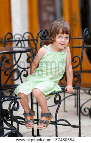 Peekaboo Girl At Coffe Table