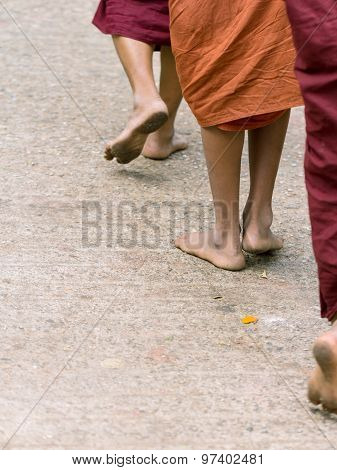 Foots Of Ascetic Buddhist Monk Walking At The Way To  Kyaikhtiyo.