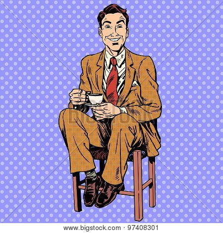Man drinking tea sitting on the stool