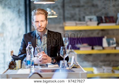 Businessman In A Restaurant Sitting At The Table