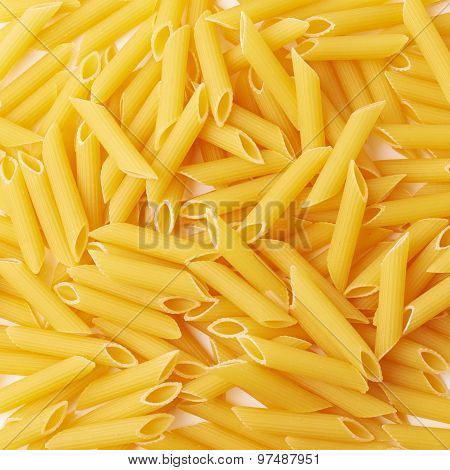 Surface covered with penne pasta