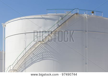 White Tanks In Tank Farm With Iron Staircase