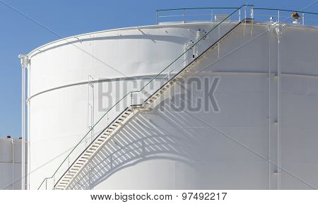 White Tanks In Tank Farm With Iron Staircase