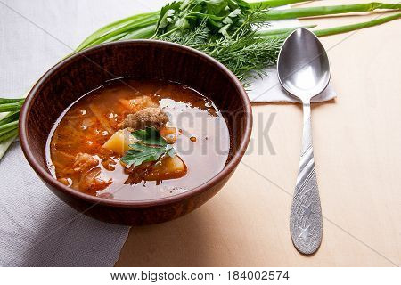 Borsch - Traditional Ukrainian And Russian Red Beetroot Soup With Red Beets In Clay Bowl With Metal