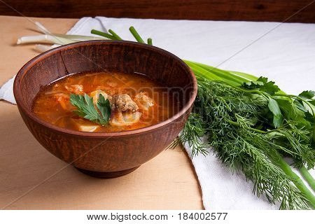 Borsch - Traditional Ukrainian And Russian Red Beetroot Soup With Red Beets In Clay Bowl On Wooden B