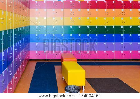 The wall is decorated with multi-colored storage chambers. A variant of the interior for children's rooms shops gambling halls. Numbered cell storage in a baggage room