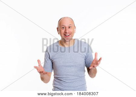Baldheaded Man With Open Hands Looking Surprised