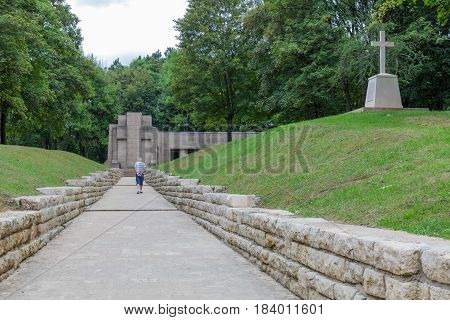 VERDUN FRANCE - AUGUST 19 2016: Old man is visiting the First World War One memorial Trench of Bayonets at Douaumont
