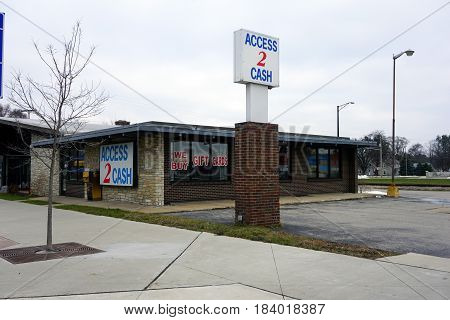 KALKASKA, MICHIGAN / UNITED STATES - NOVEMBER 27, 2016: Access 2 Cash provides loans in downtown Kalkaska.