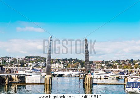 The Gateway To The Sailing Marina With Anchored Boats And Yachtami Metal Moveable Bridge, A Seaside