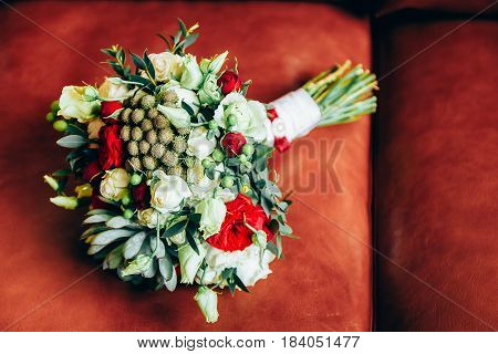 Wedding bouquet of white roses laying in fresh