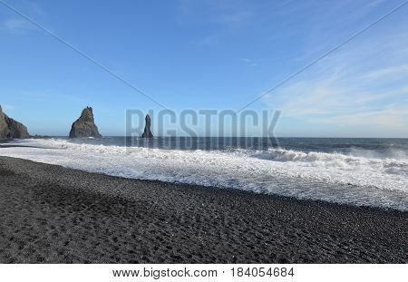 Sea stacks off the black sand beach in southern Iceland.
