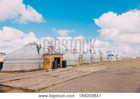 Landscapes Of Mongolia, Yurts Against The Backdrop Of Blue Sky