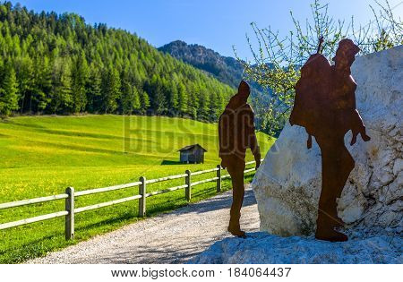 Latemar Italy - April 28 2012: A hikers memorial in the green valley near the village