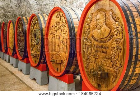 San Michele All'Adige Italy - June 28 2012: Fondazione Edmund Mach the historic cellars of the Agostiniana Abbey with decorated oak barrels