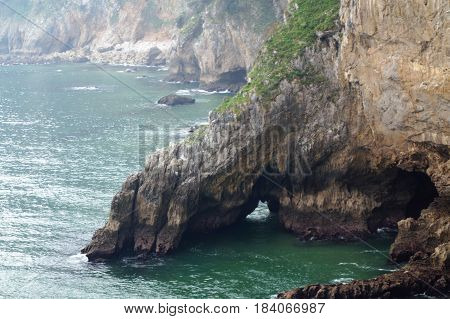 Route and cliffs of horse lighthouse on Mount Buceiro, Emerald Coast, Santoña, Cantabria, Spain