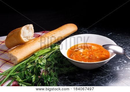 Vegetables And Meat In Red Beetroot Soup Or Borsch In White Plate On Dark Marble Background.