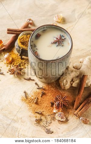 Traditional Indian Masala Tea In Ceramic Cup With Spices To Milk