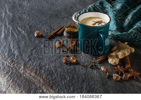 Traditional Indian Masala Tea In Ceramic Cup With Spices To Milk