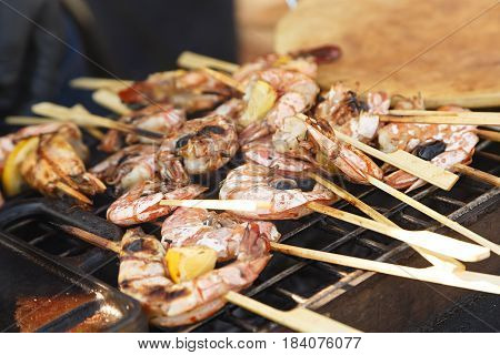 Grilled shrimp on skewers seafood appetizer for a banquet