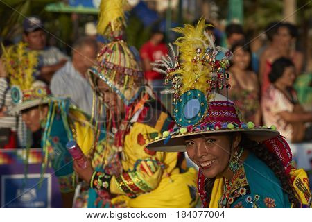 ARICA, CHILE - FEBRUARY 11, 2017: Tinkus Dance Group dressed in ornate costumes performing a traditional dance during a street parade at the annual Carnaval Andino con la Fuerza del Sol.